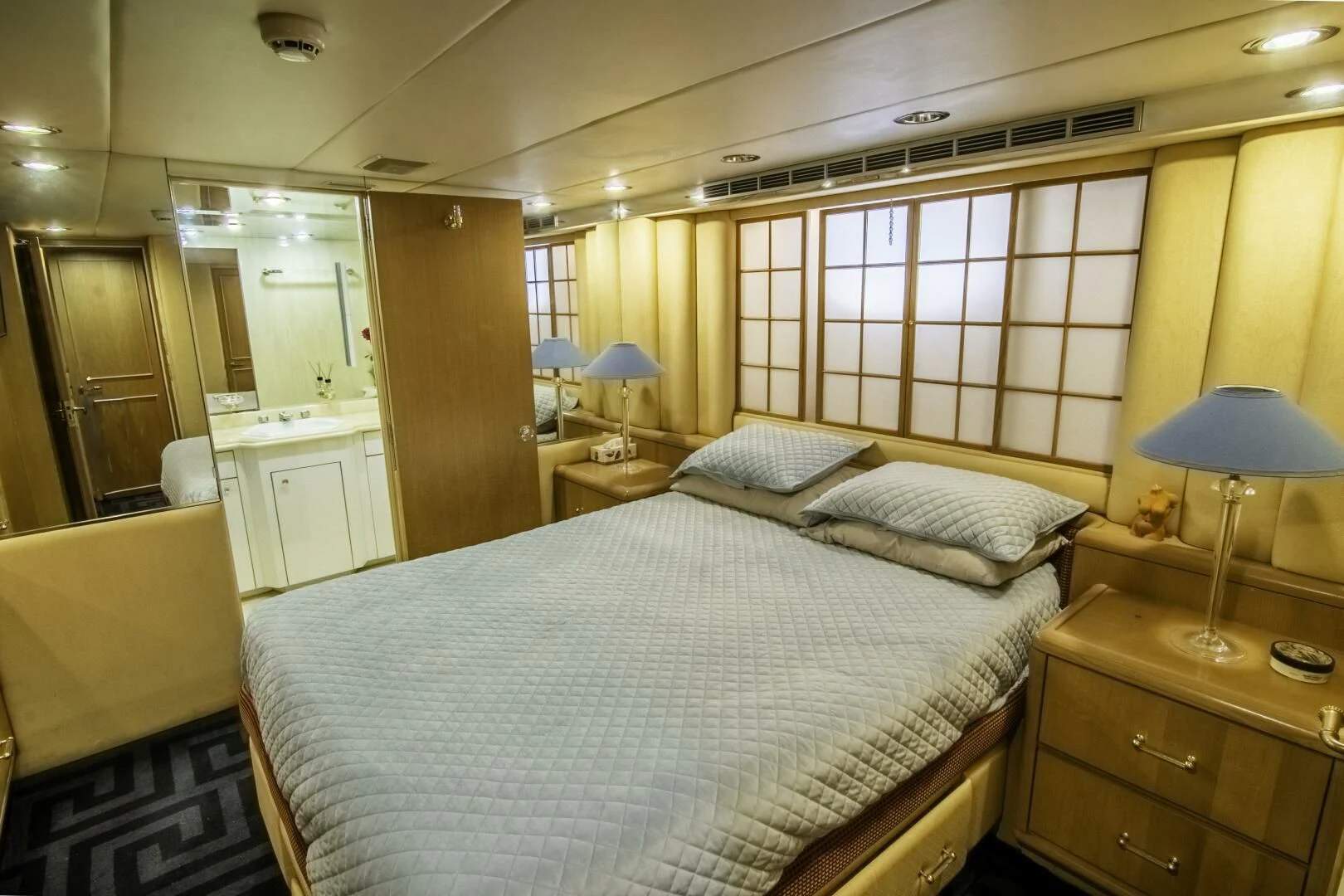 a bedroom with a large bed aboard LADY AUDREY Yacht for Sale