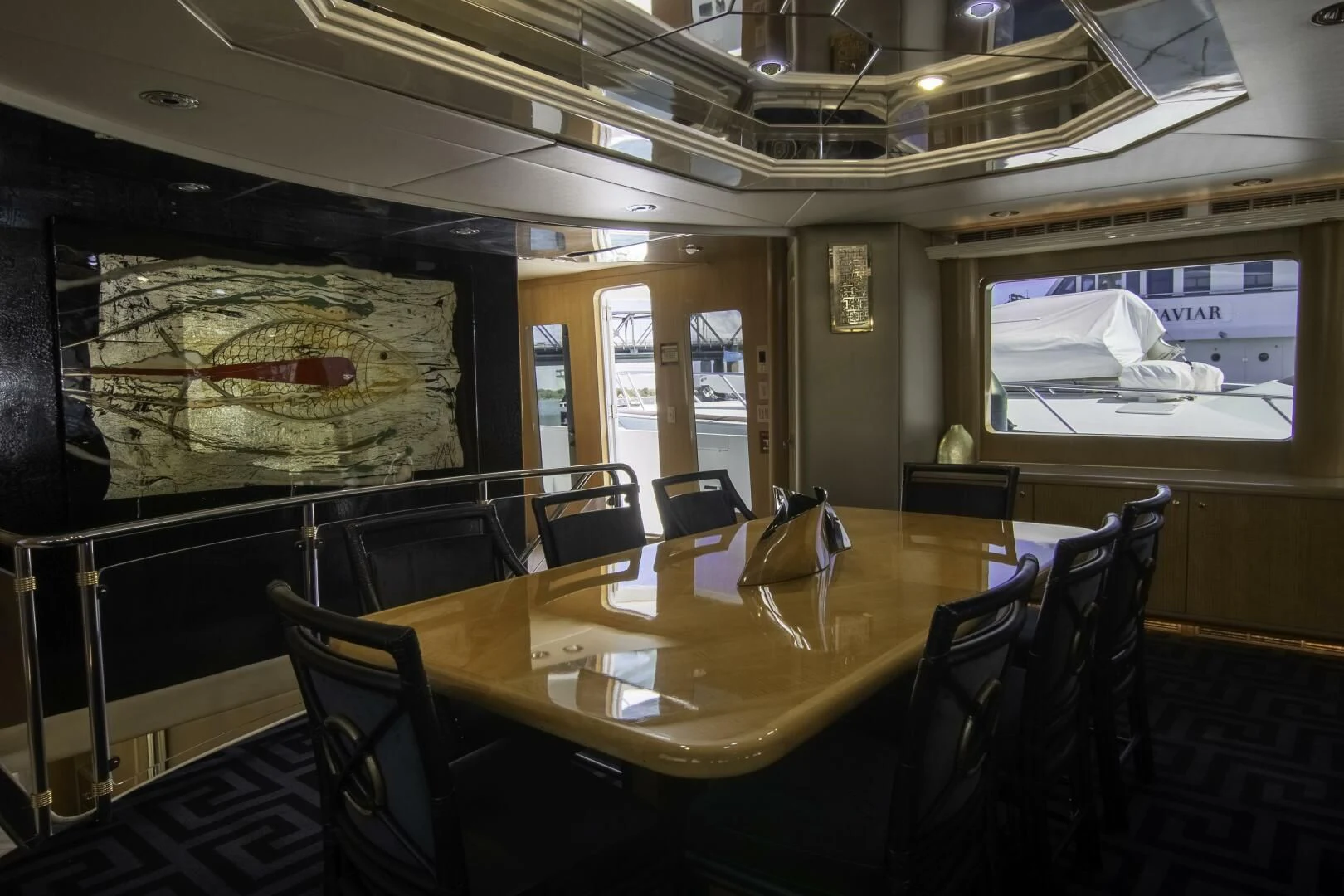 a large room with a table and chairs aboard LADY AUDREY Yacht for Sale