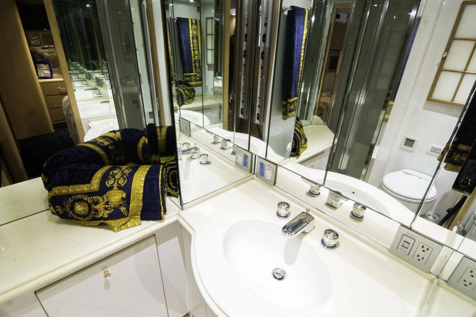 a bathroom with a large mirror aboard LADY AUDREY Yacht for Sale