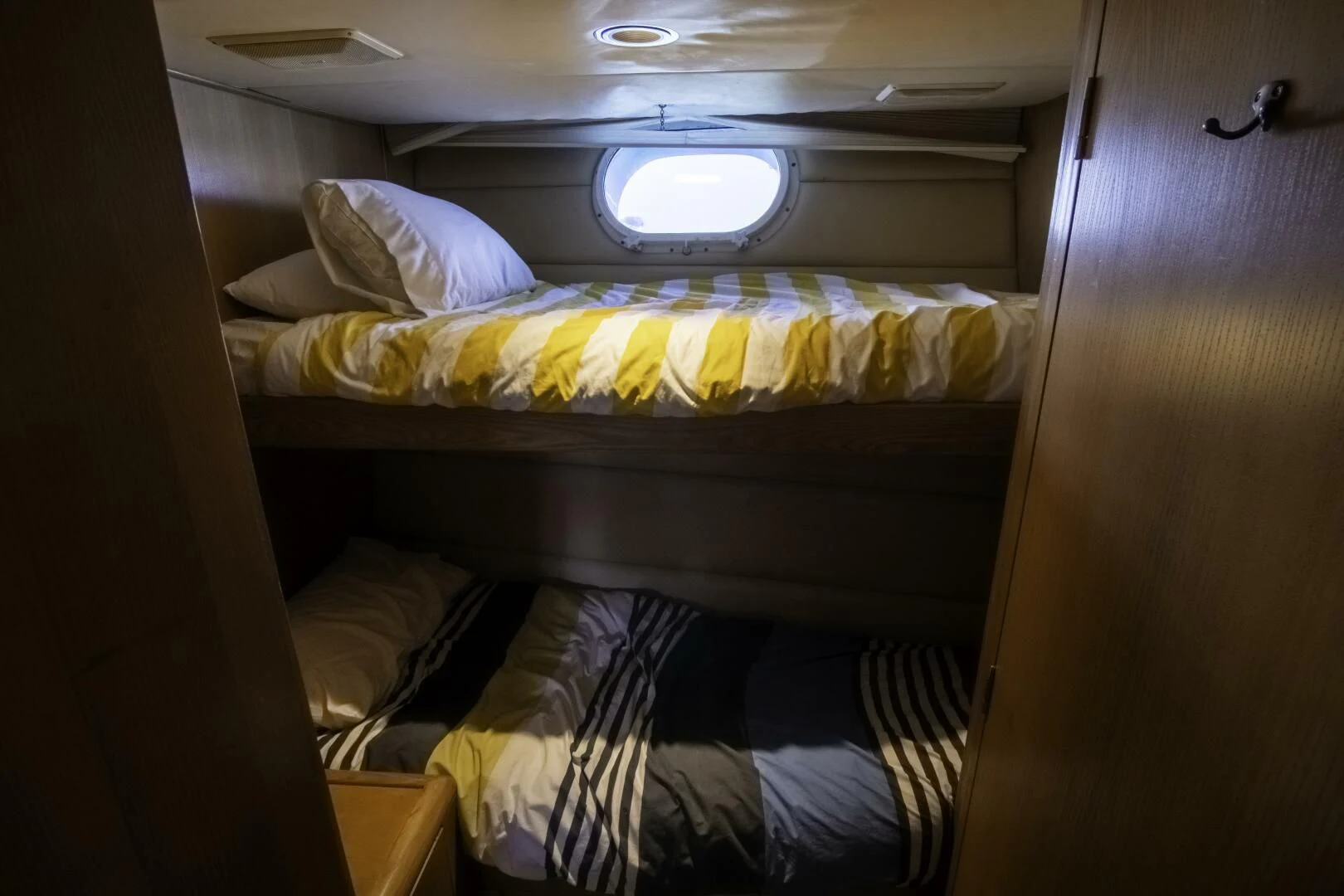 a bed with white sheets aboard LADY AUDREY Yacht for Sale