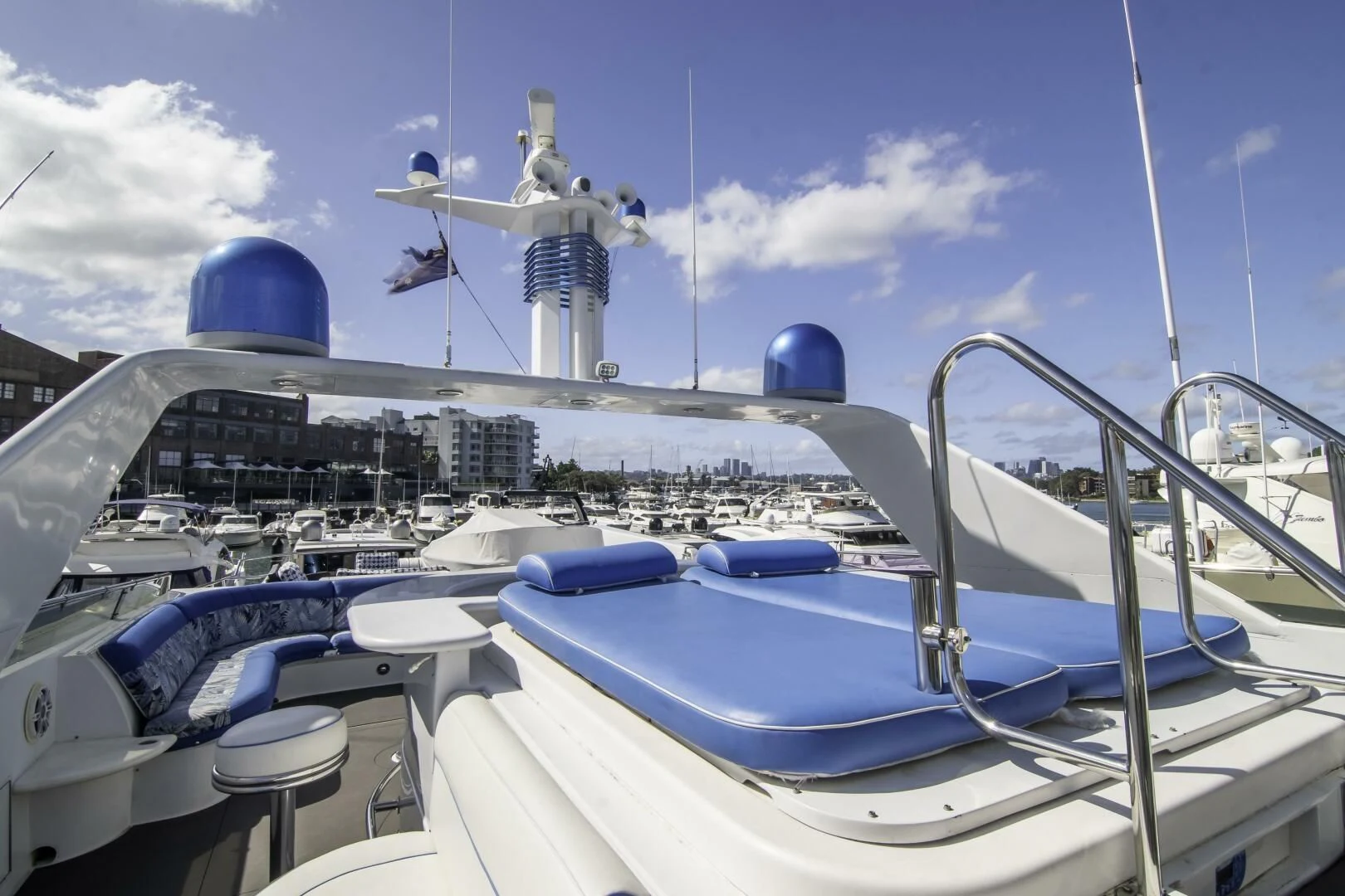 a boat with a blue canopy and a white satellite dish on top aboard LADY AUDREY Yacht for Sale