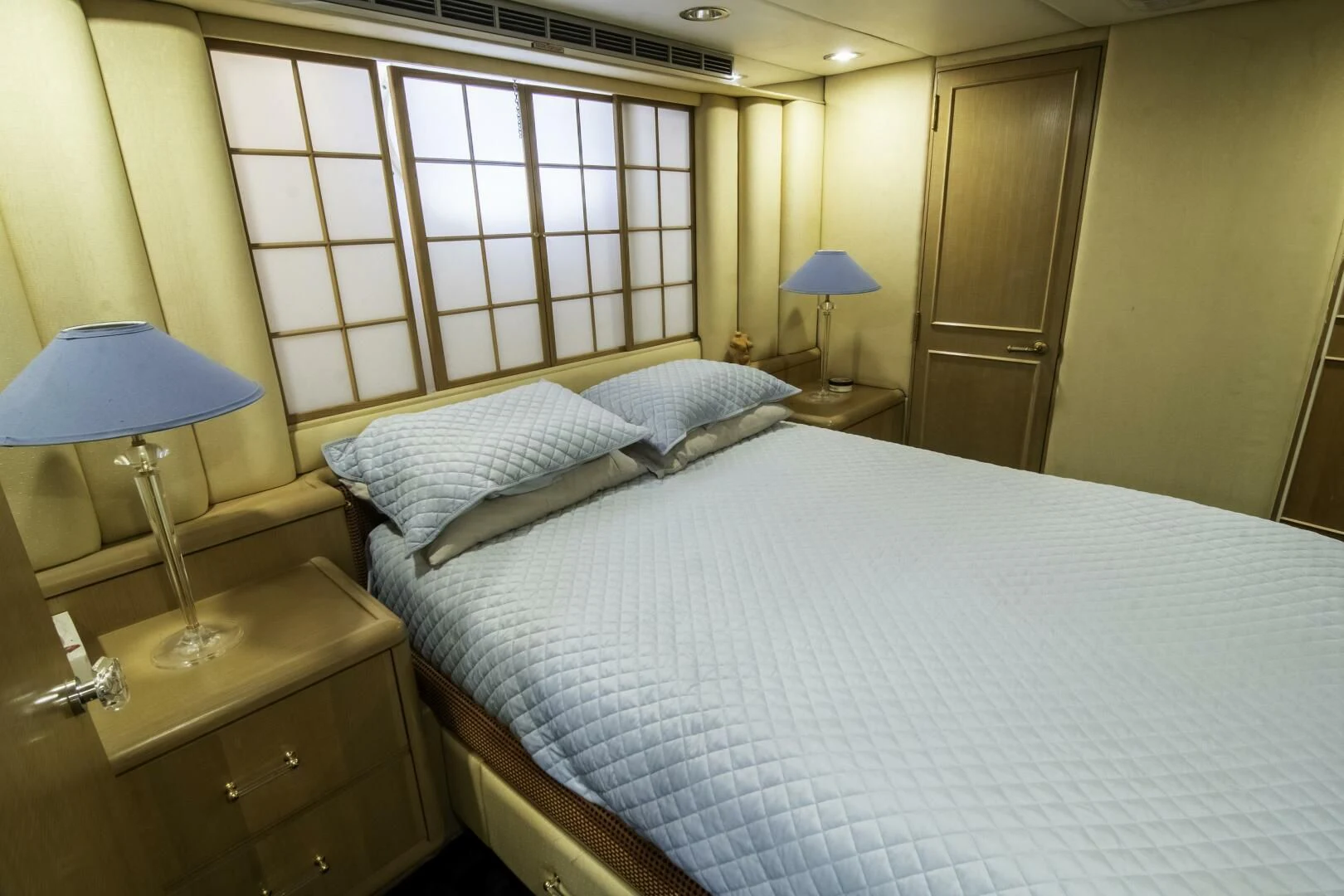 a bed with a white sheet aboard LADY AUDREY Yacht for Sale