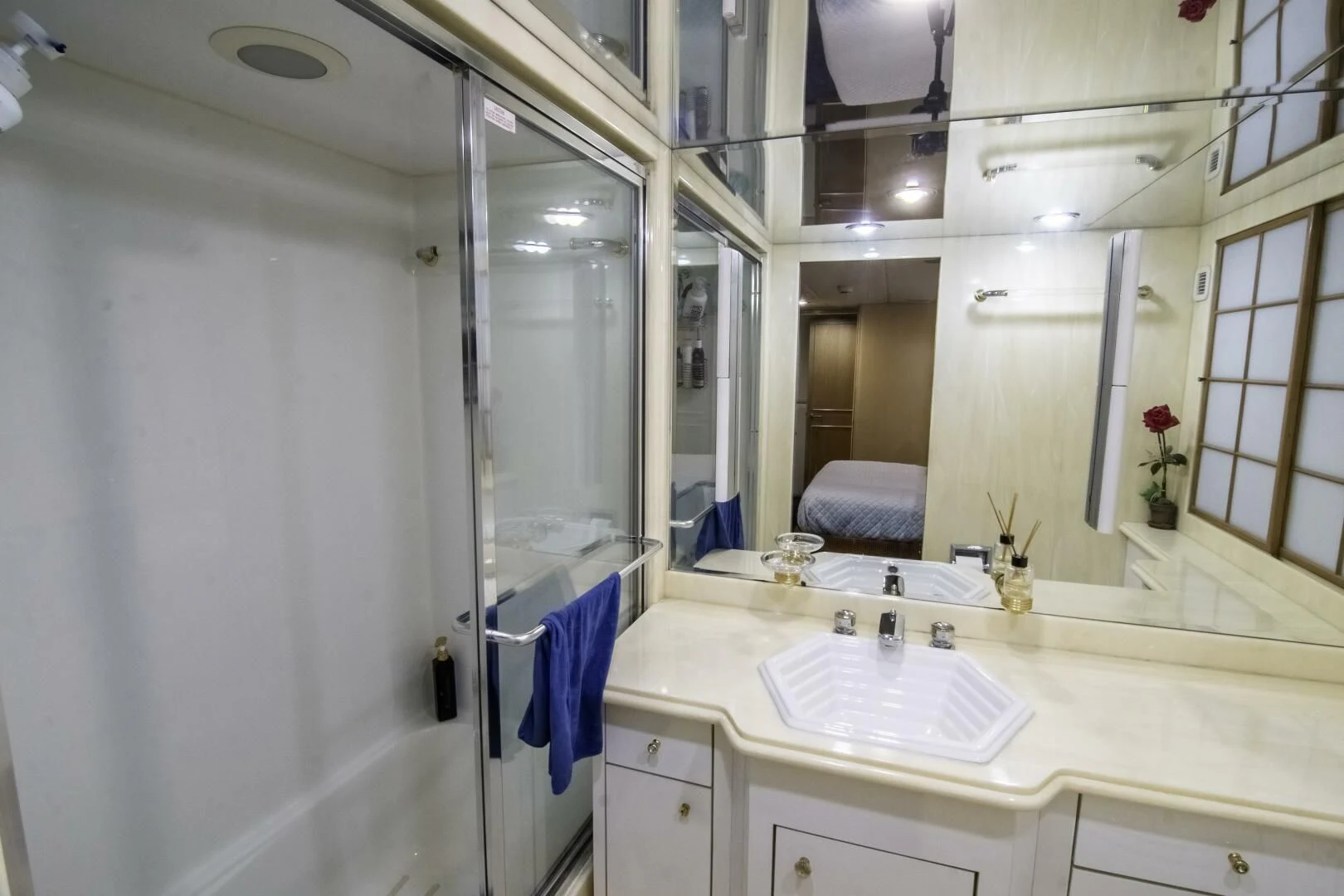 a bathroom with a sink and a mirror aboard LADY AUDREY Yacht for Sale