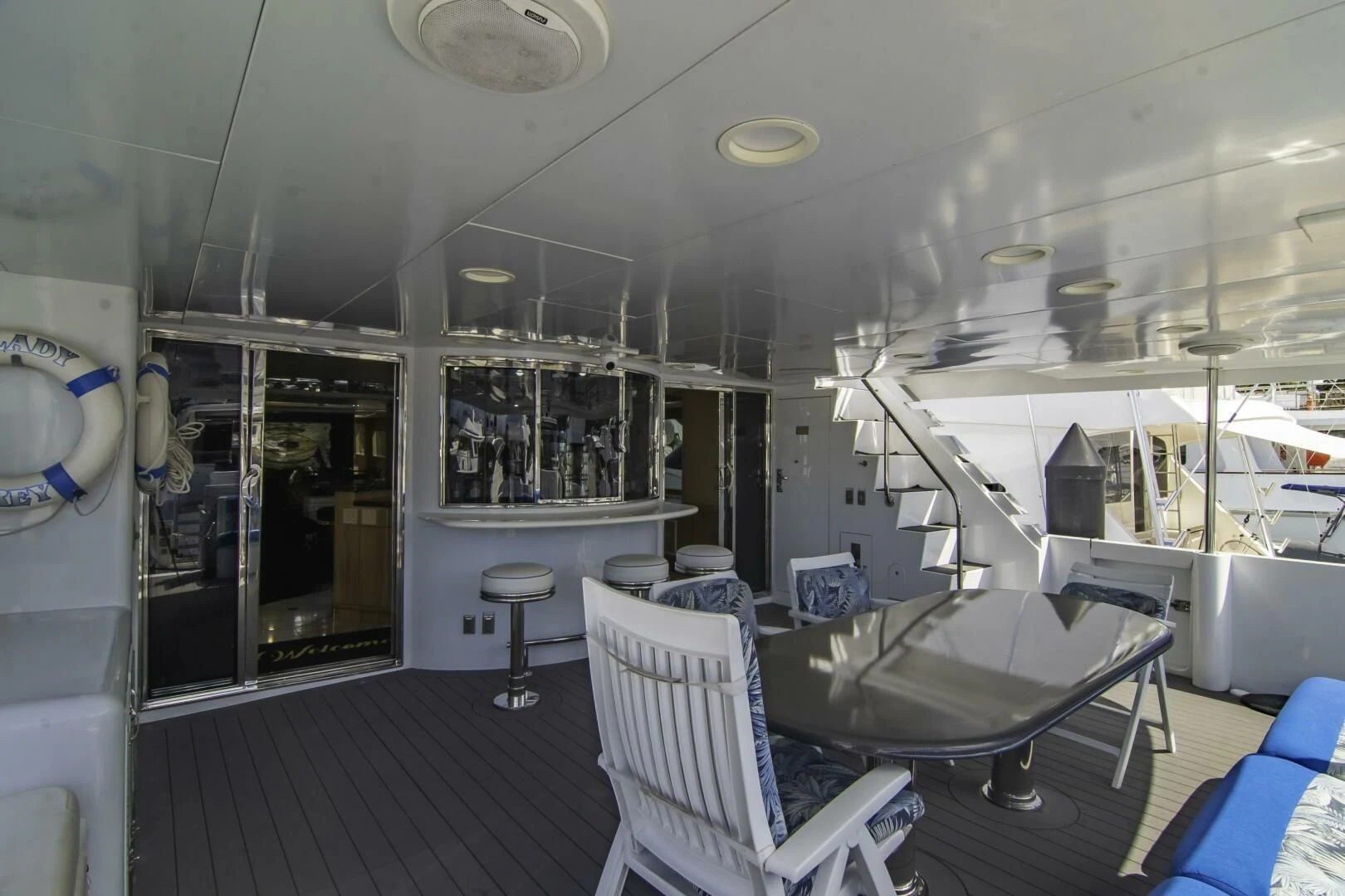 a room with a table chairs and a large window aboard LADY AUDREY Yacht for Sale