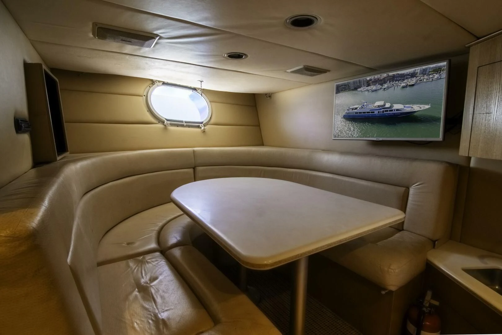 a room with a table and chairs aboard LADY AUDREY Yacht for Sale
