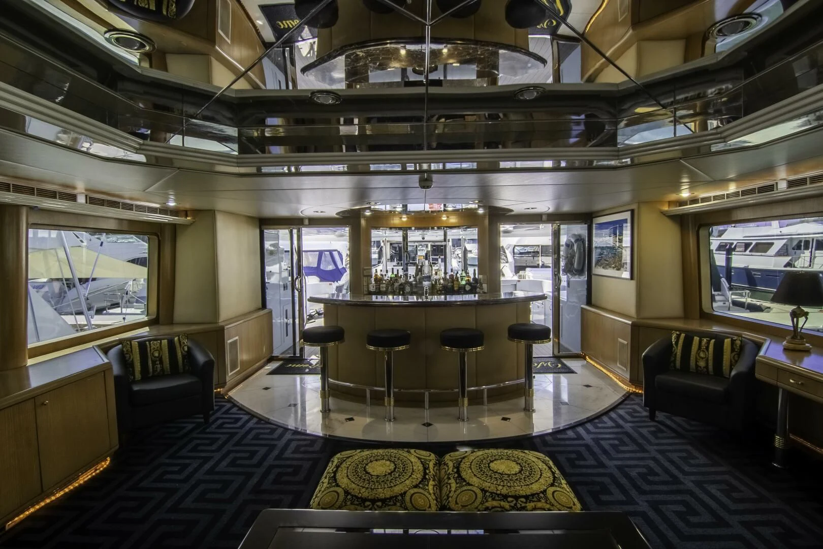a large room with a large bar and a large window aboard LADY AUDREY Yacht for Sale