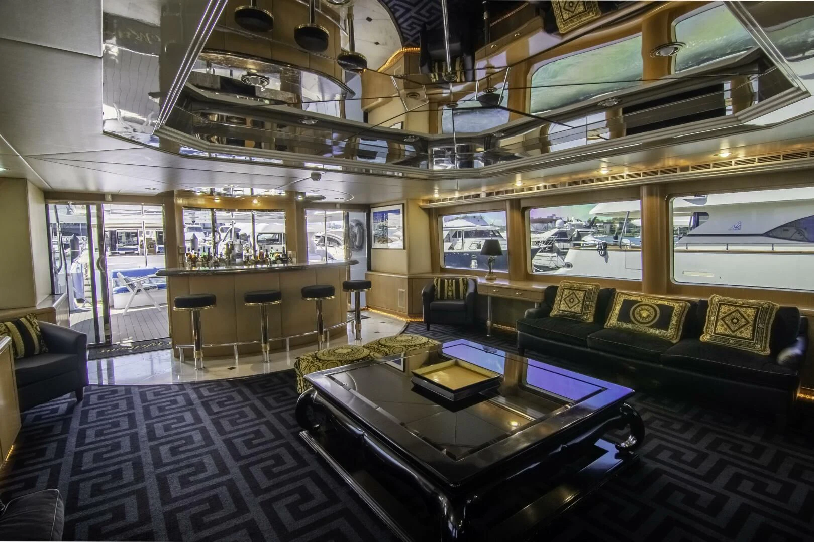 a room with a table and couches aboard LADY AUDREY Yacht for Sale