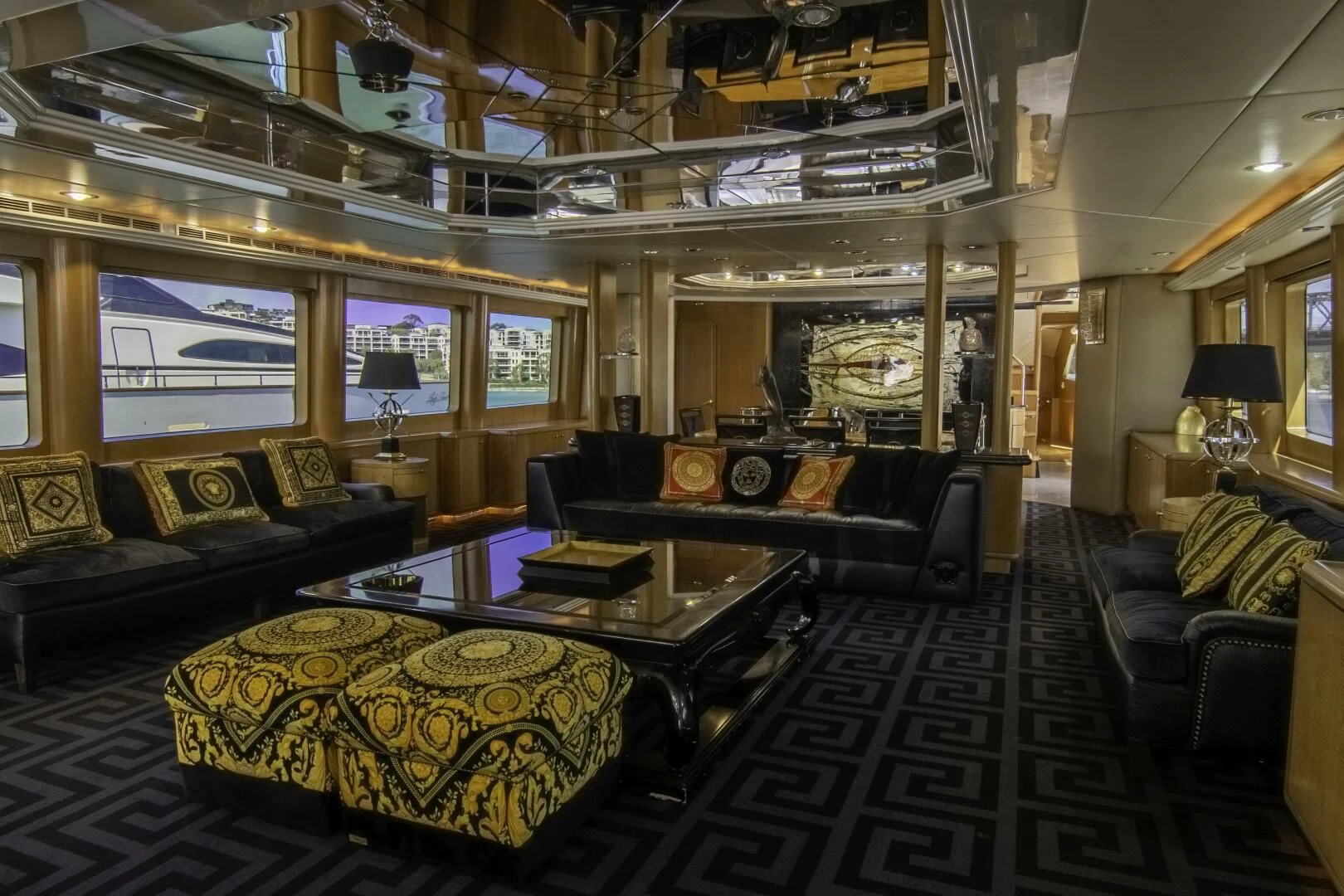 a living room with a large chandelier aboard LADY AUDREY Yacht for Sale