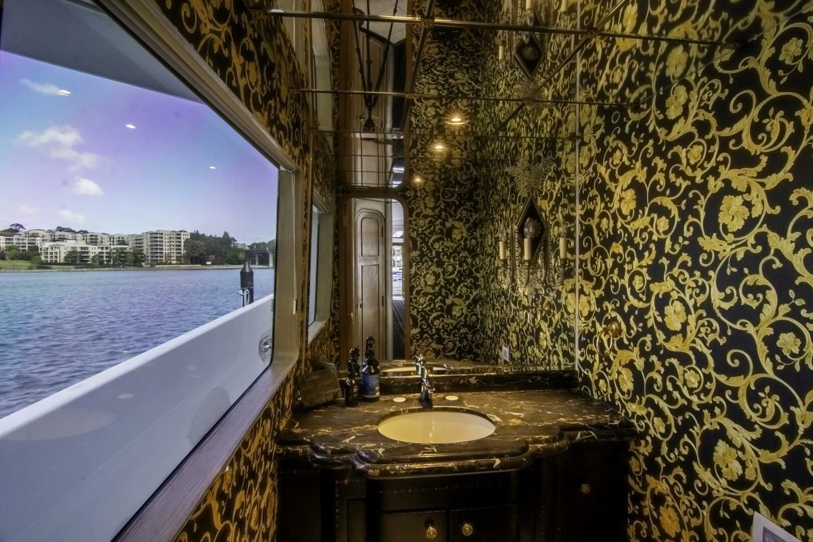 a bathroom with a sink and bathtub aboard LADY AUDREY Yacht for Sale