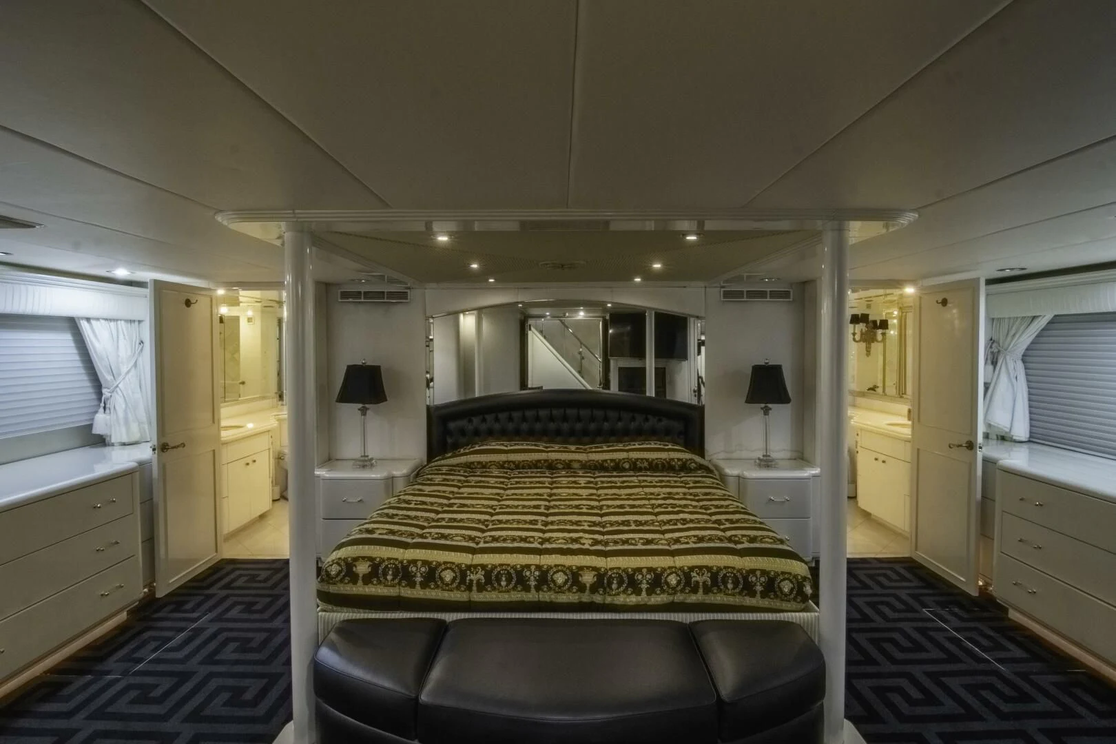 a bedroom with a bed and a desk aboard LADY AUDREY Yacht for Sale