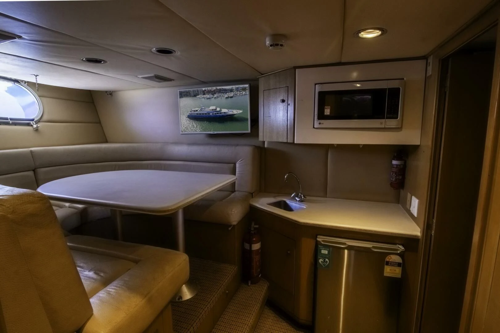 a room with a table and chairs aboard LADY AUDREY Yacht for Sale