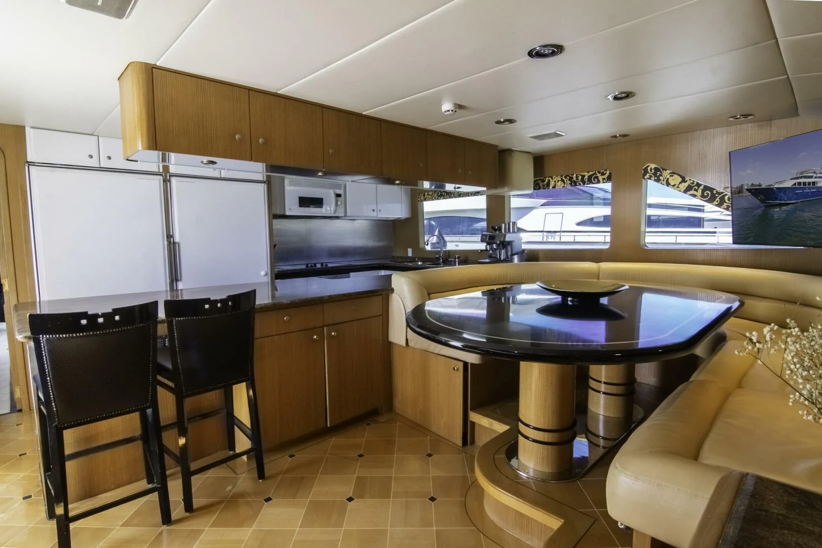 a kitchen with a table and chairs aboard LADY AUDREY Yacht for Sale
