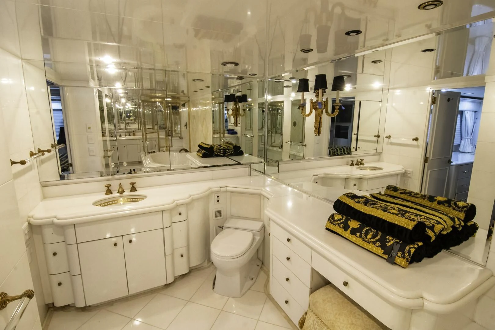 a bathroom with a tub sink and toilet aboard LADY AUDREY Yacht for Sale