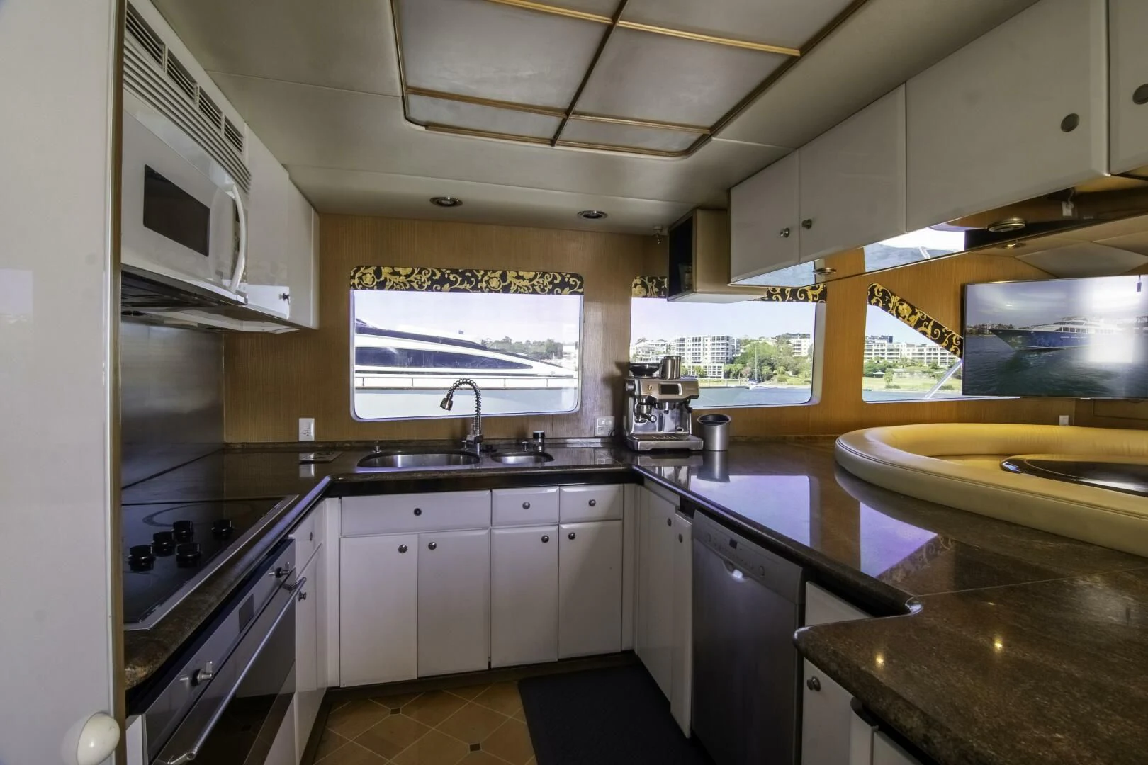 a kitchen with a stove and sink aboard LADY AUDREY Yacht for Sale