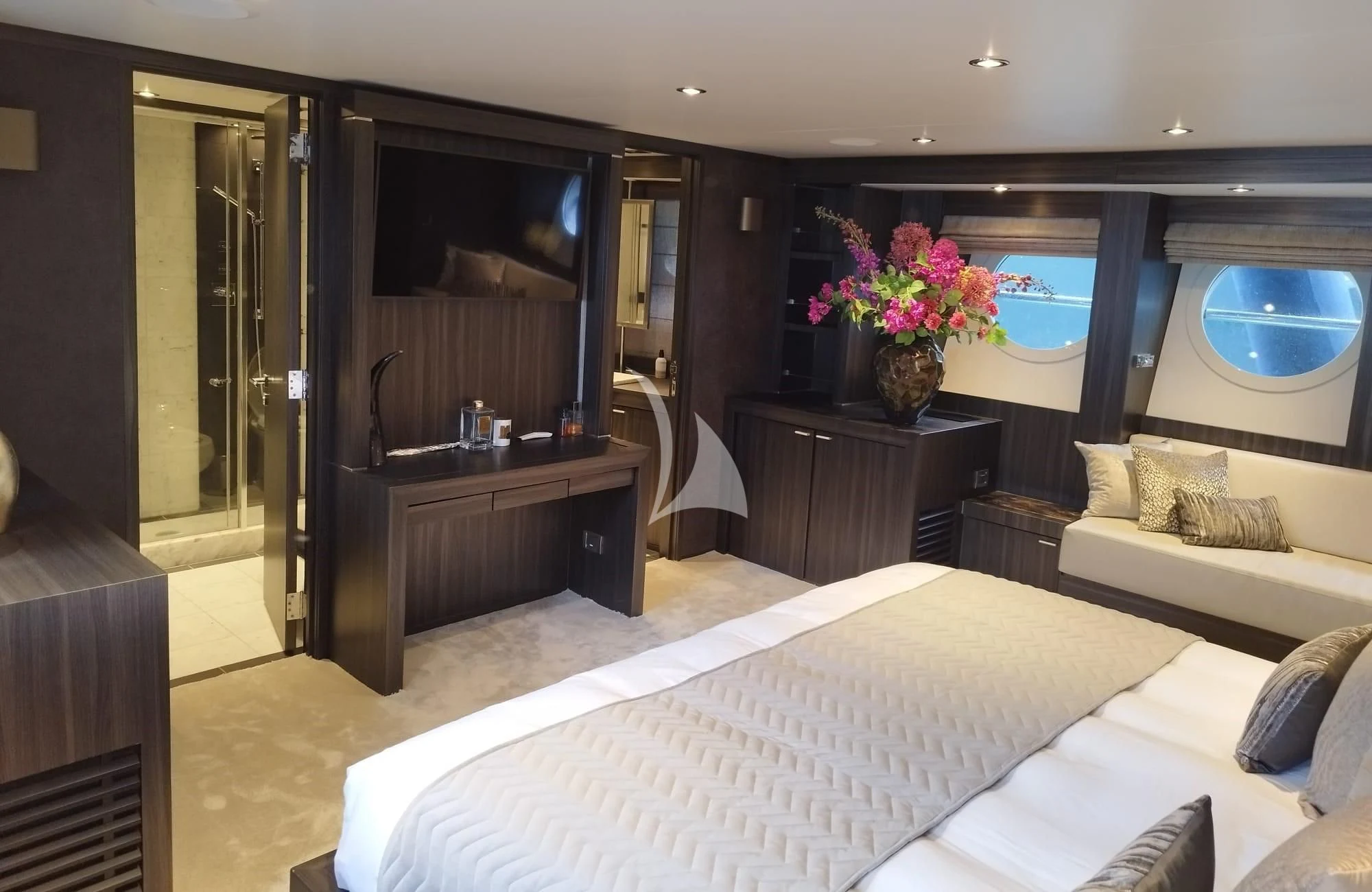a bedroom with a bed and a television aboard BAGHEERA Yacht for Charter
