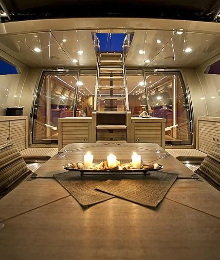 a large room with a staircase and a glass display case aboard BAGHEERA Yacht for Charter