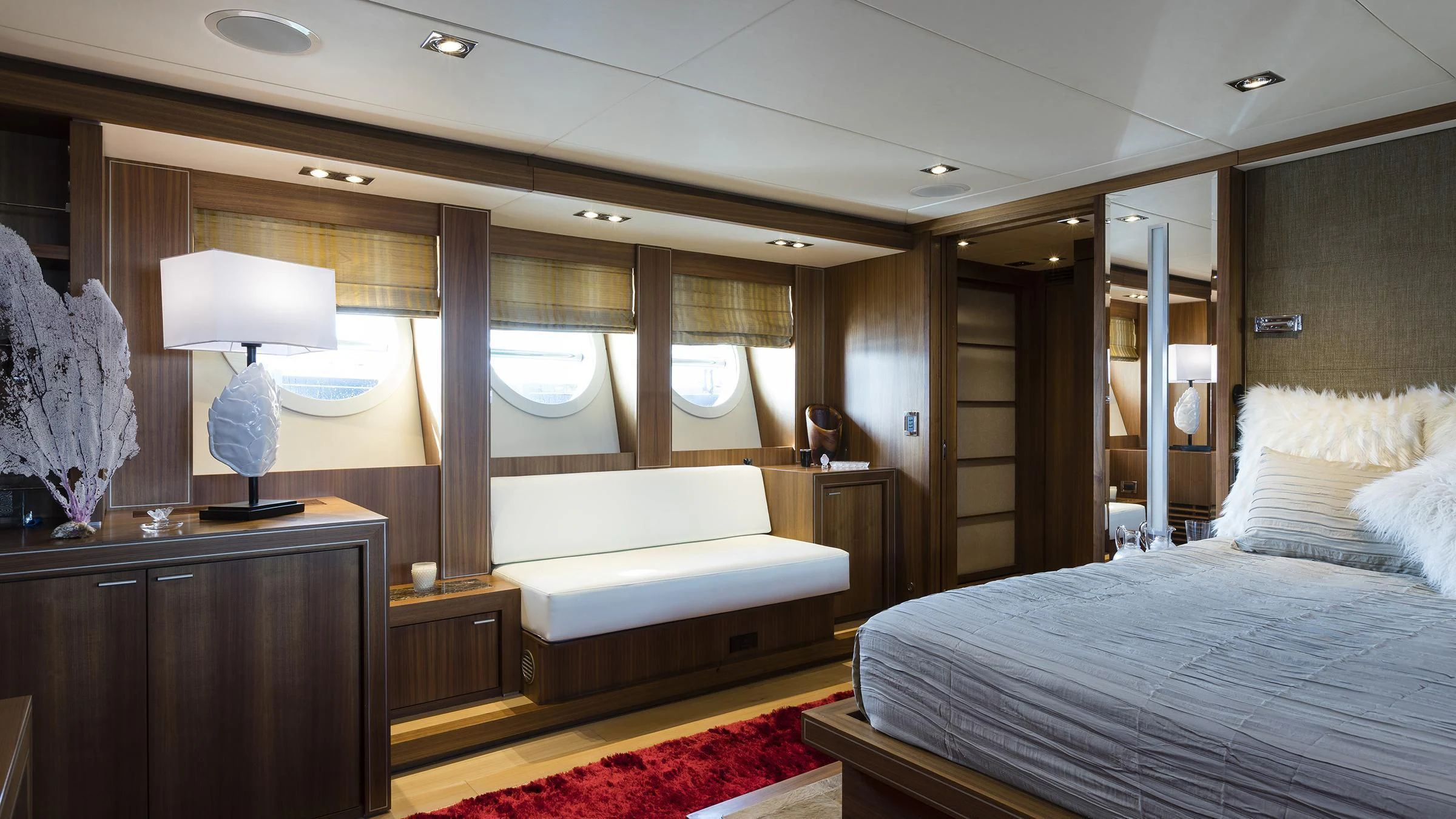 a room with a bed and a desk aboard BAGHEERA Yacht for Charter