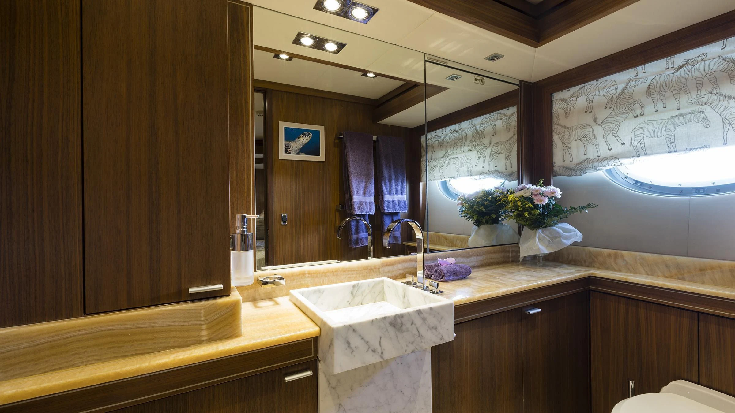 a bathroom with a large mirror aboard BAGHEERA Yacht for Charter