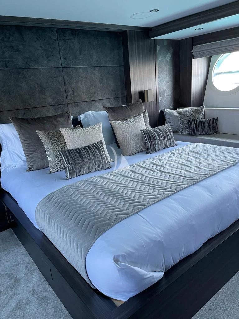a bed with pillows aboard BAGHEERA Yacht for Charter