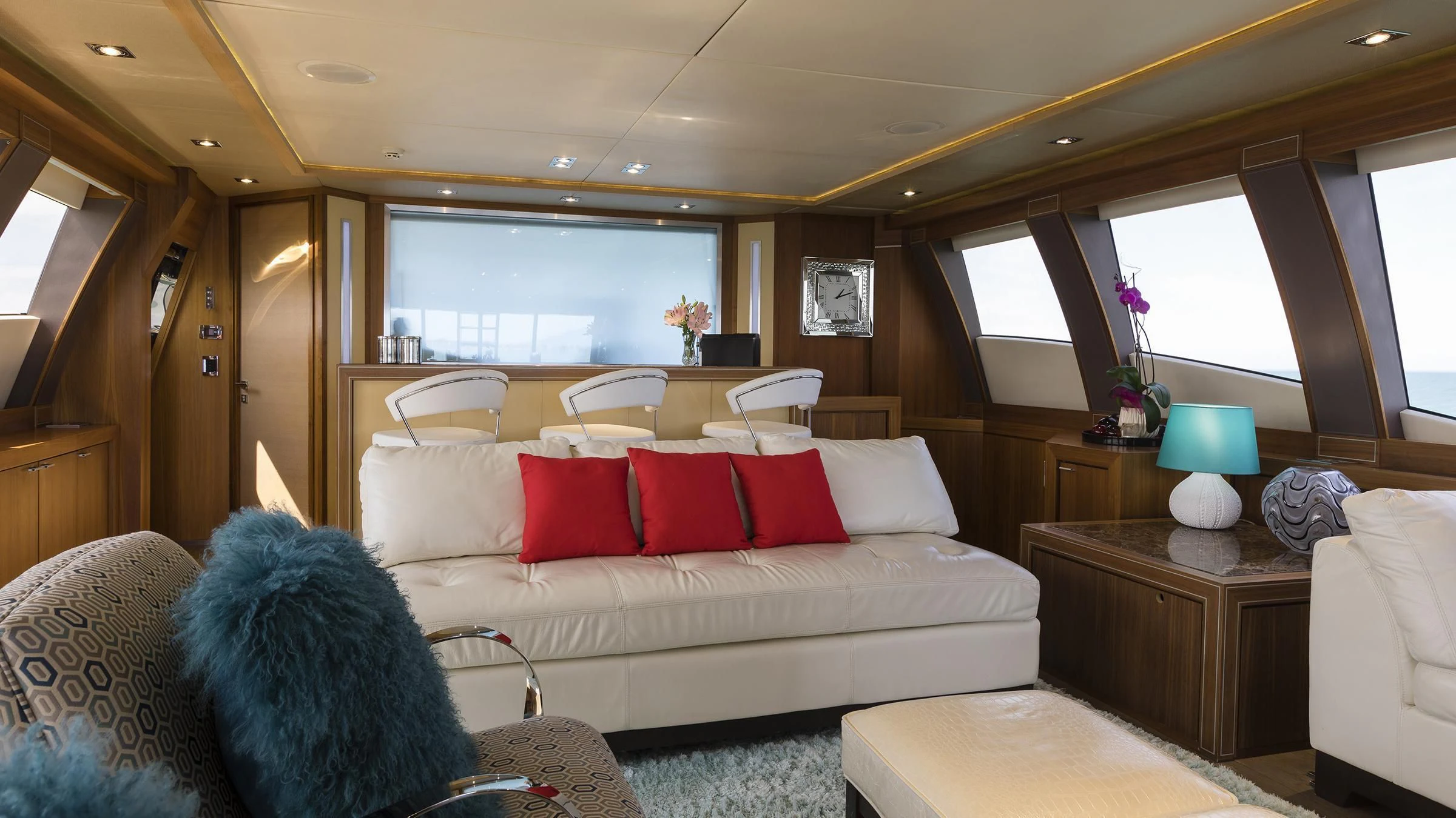 a living room with a white couch and a white sofa aboard BAGHEERA Yacht for Charter