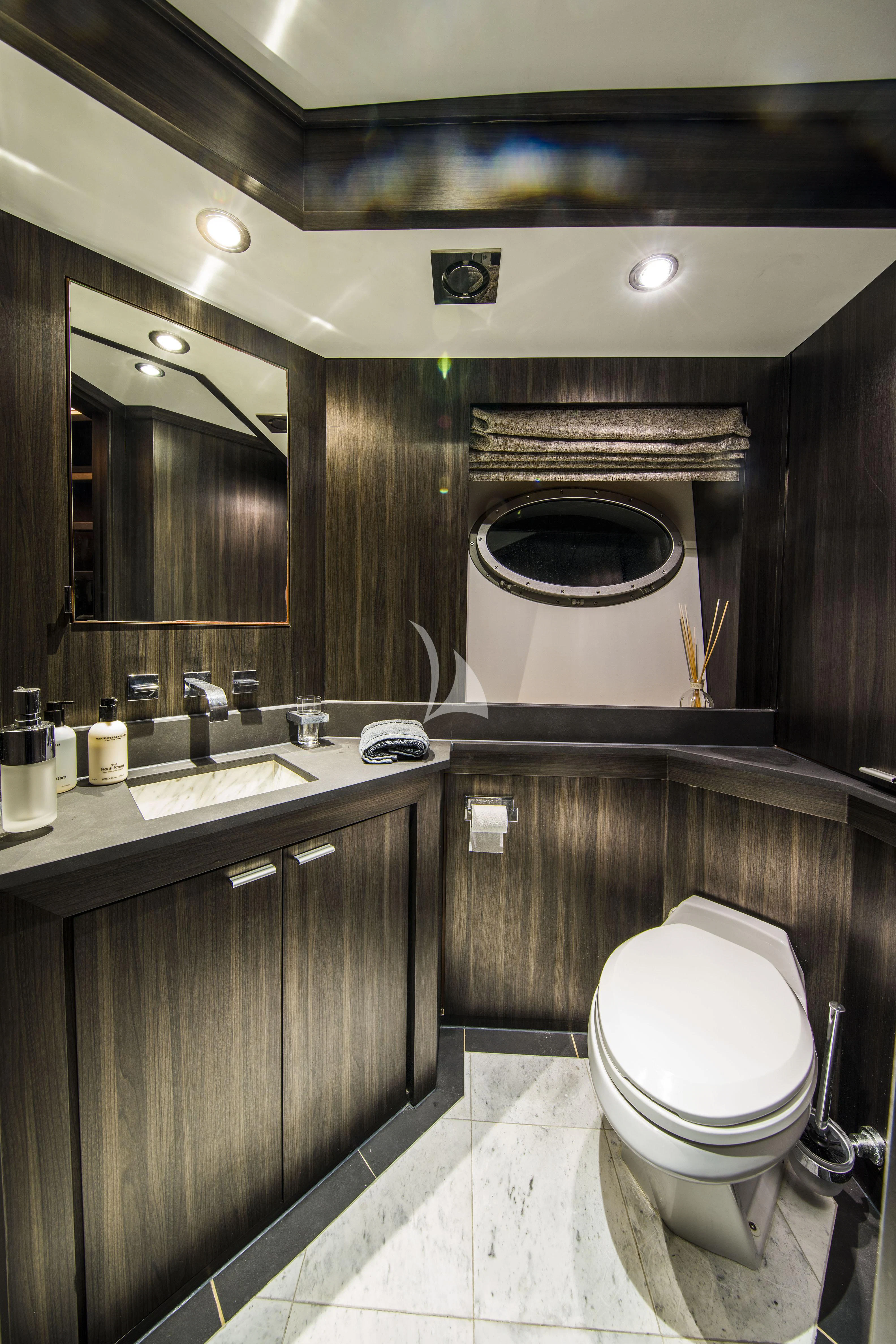 a bathroom with a large mirror aboard BAGHEERA Yacht for Charter