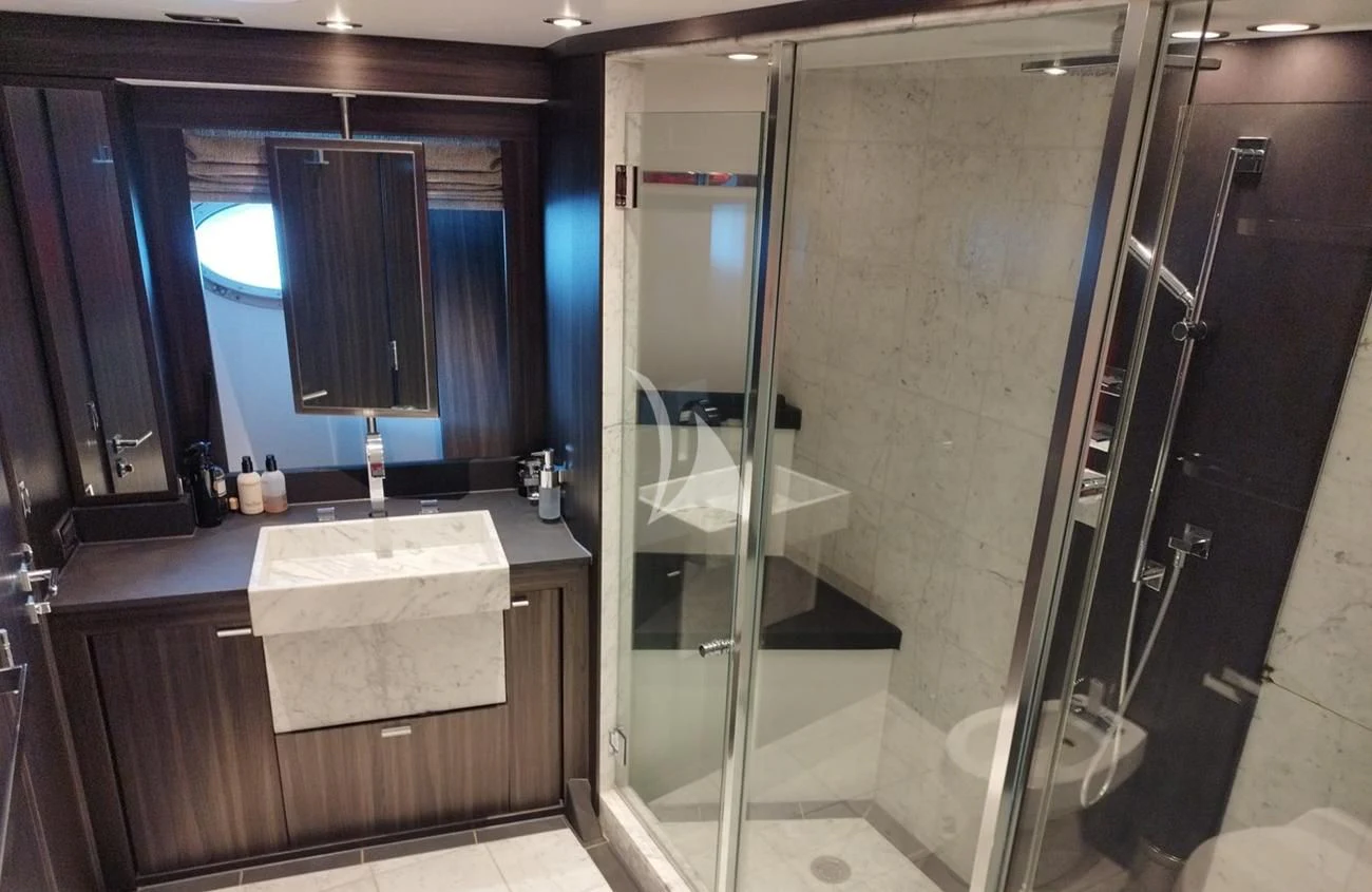 a bathroom with a glass shower aboard BAGHEERA Yacht for Charter