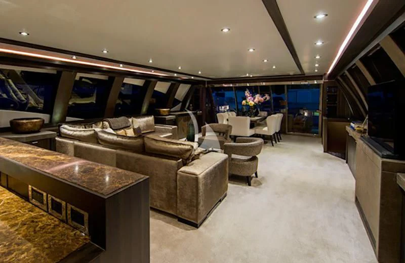 a living room with a leather couch aboard BAGHEERA Yacht for Charter