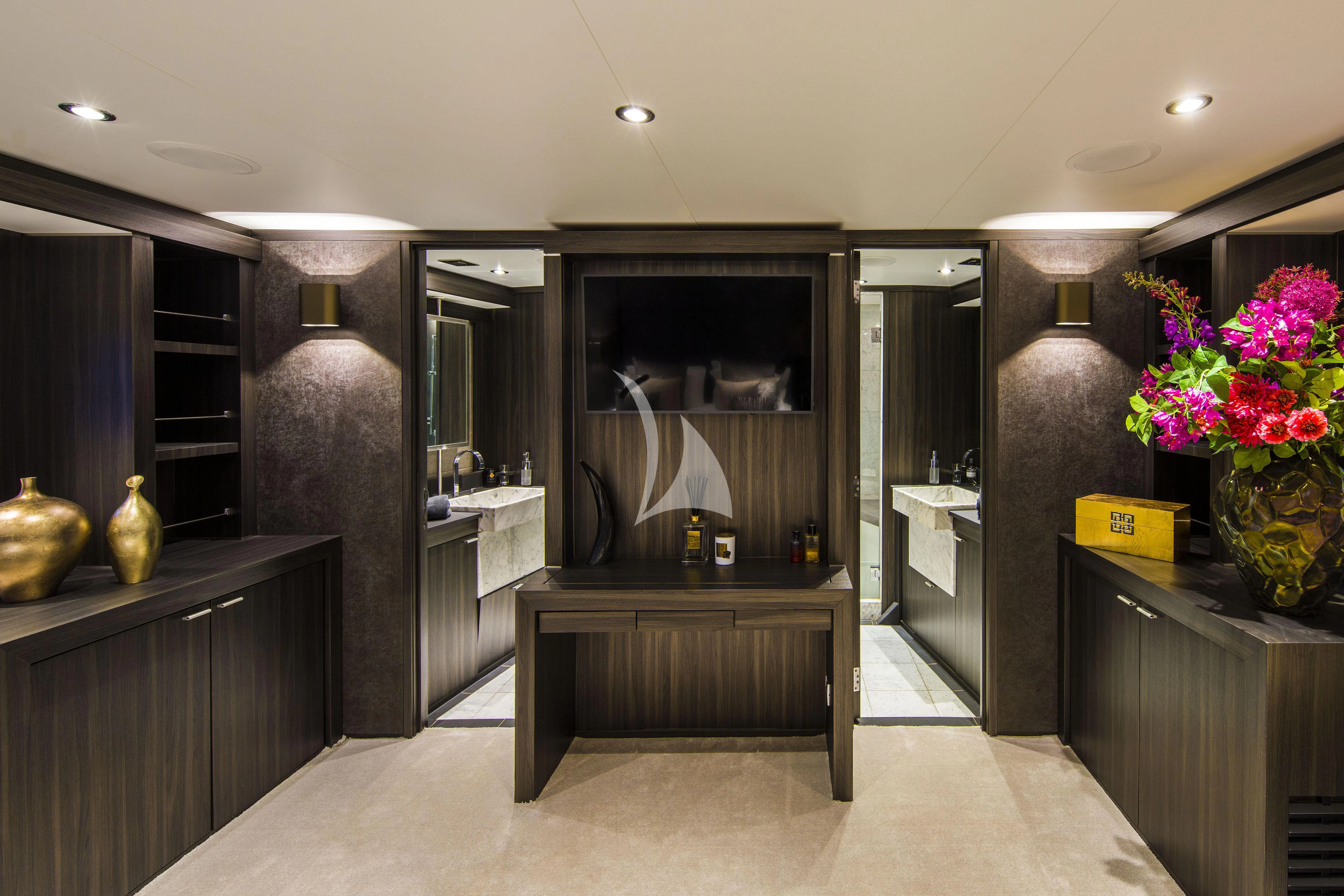 a room with a large mirror and a counter with flowers aboard BAGHEERA Yacht for Charter