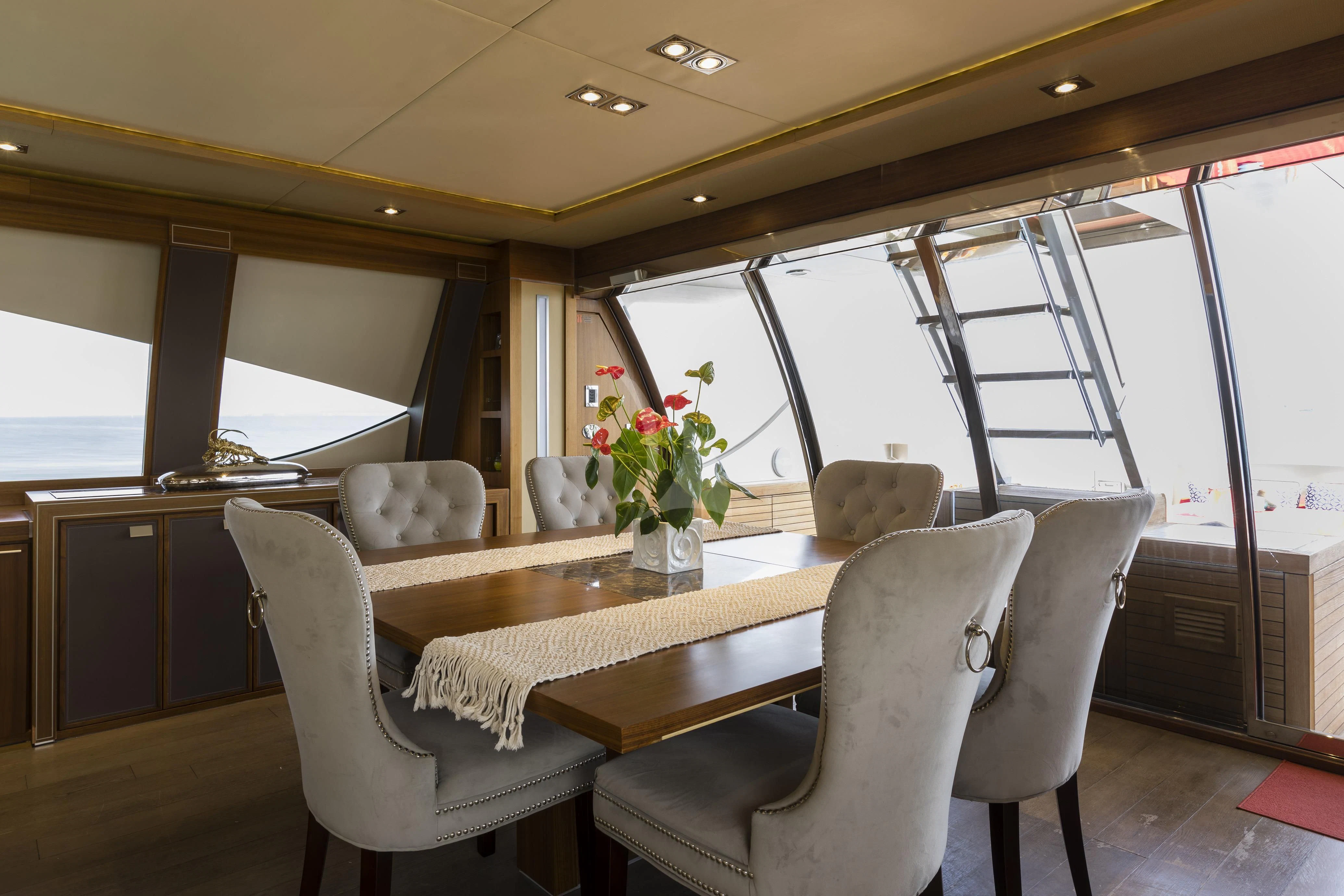 a dining table and chairs in a bus aboard BAGHEERA Yacht for Charter