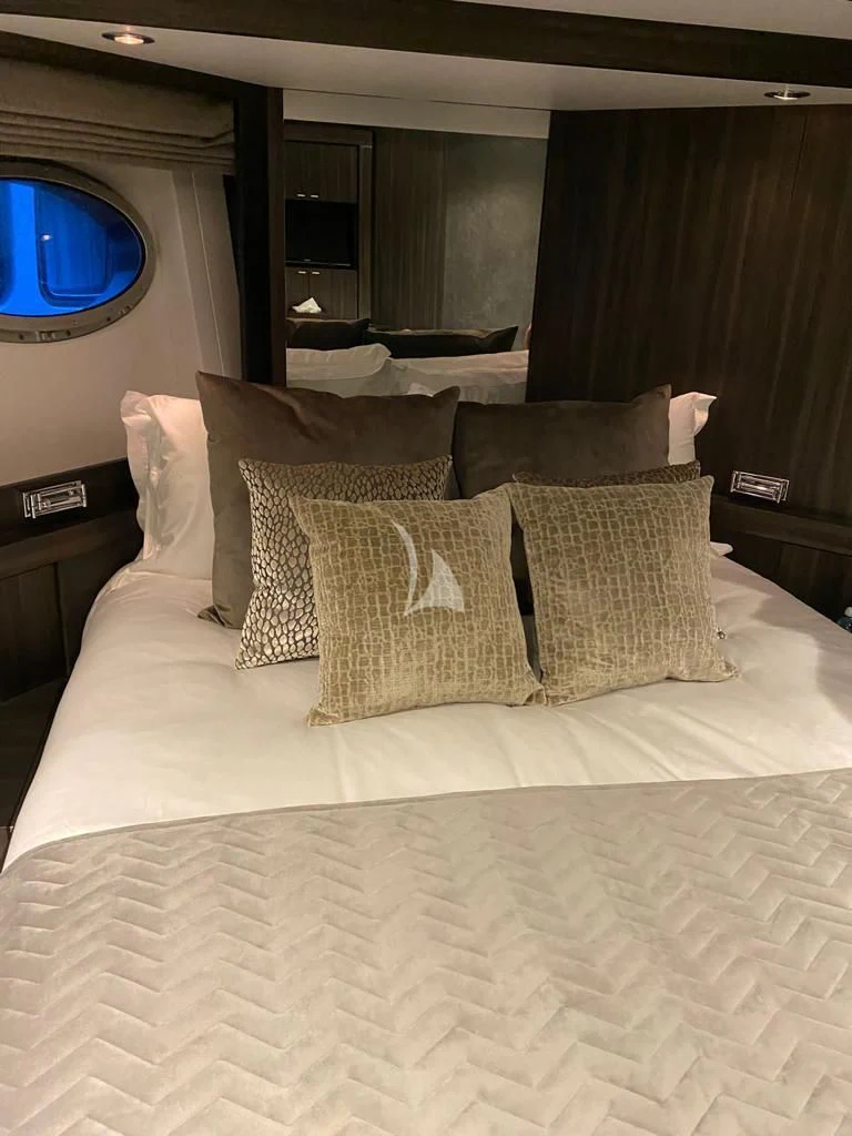 a bed with pillows aboard BAGHEERA Yacht for Charter