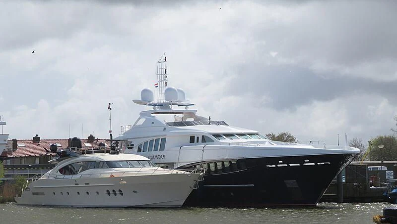 a couple of large boats in a harbor aboard BAGHEERA Yacht for Charter