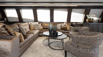 a living room with a couch and a coffee table aboard BAGHEERA Yacht for Charter