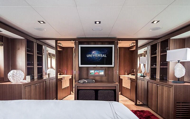 a bedroom with a tv on the wall aboard BAGHEERA Yacht for Charter