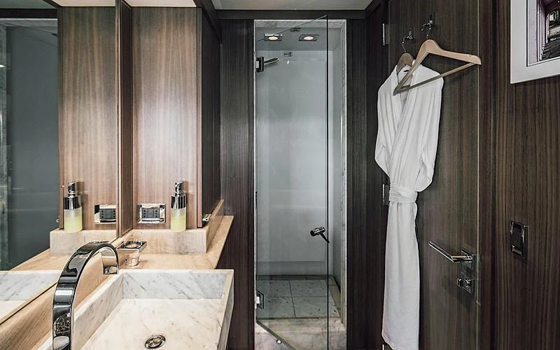 a bathroom with a sink and a shower aboard BAGHEERA Yacht for Charter