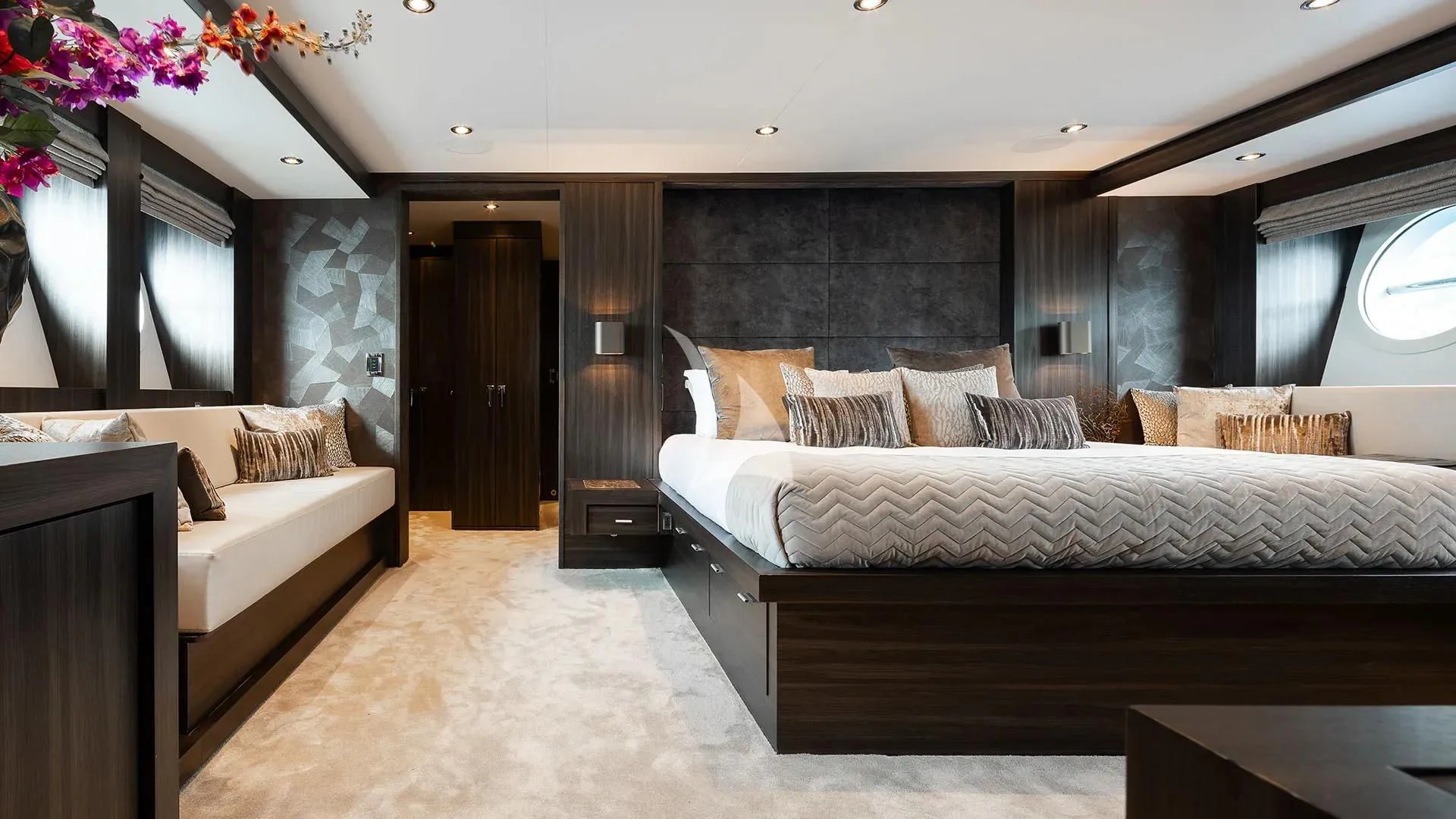 a room with a bed and a couch aboard BAGHEERA Yacht for Charter
