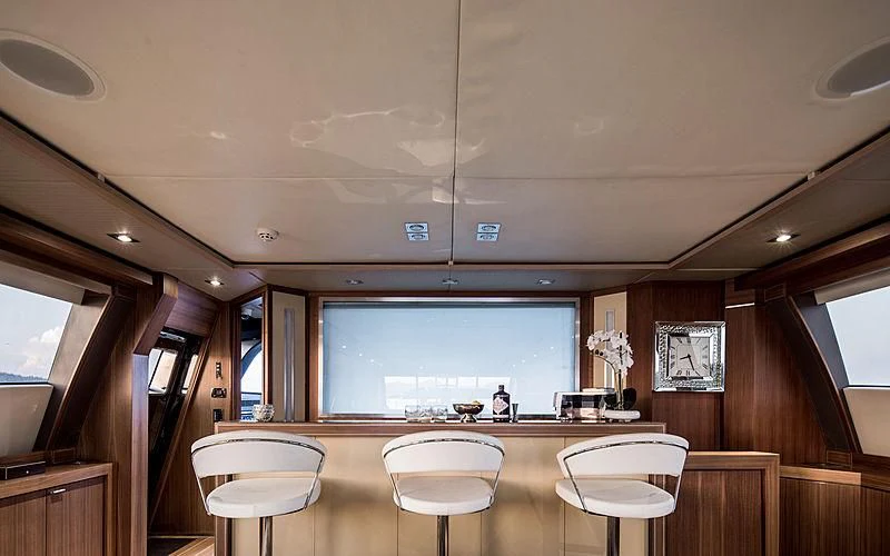 a large room with a table and chairs aboard BAGHEERA Yacht for Charter
