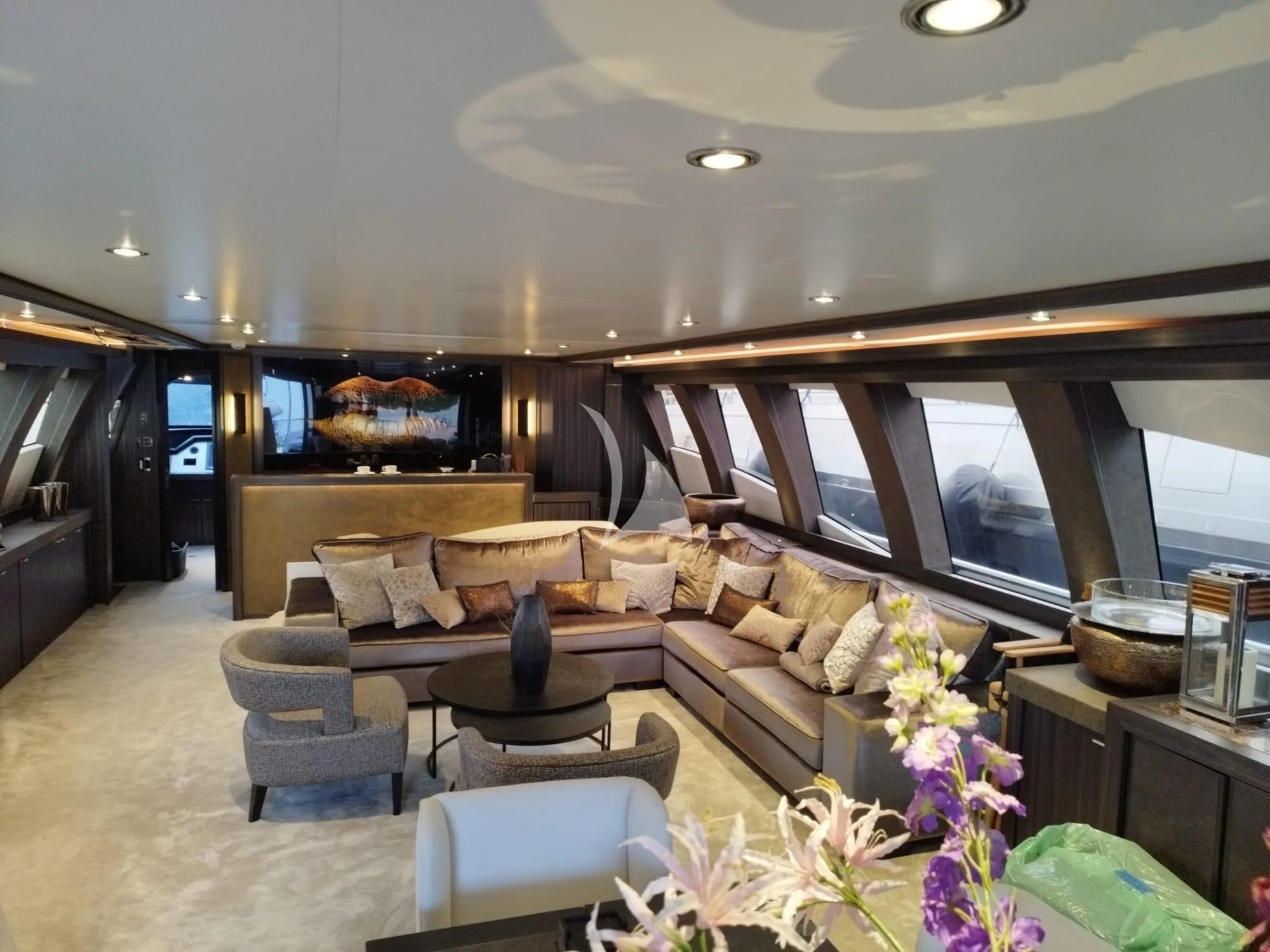 a living room with a large window aboard BAGHEERA Yacht for Charter
