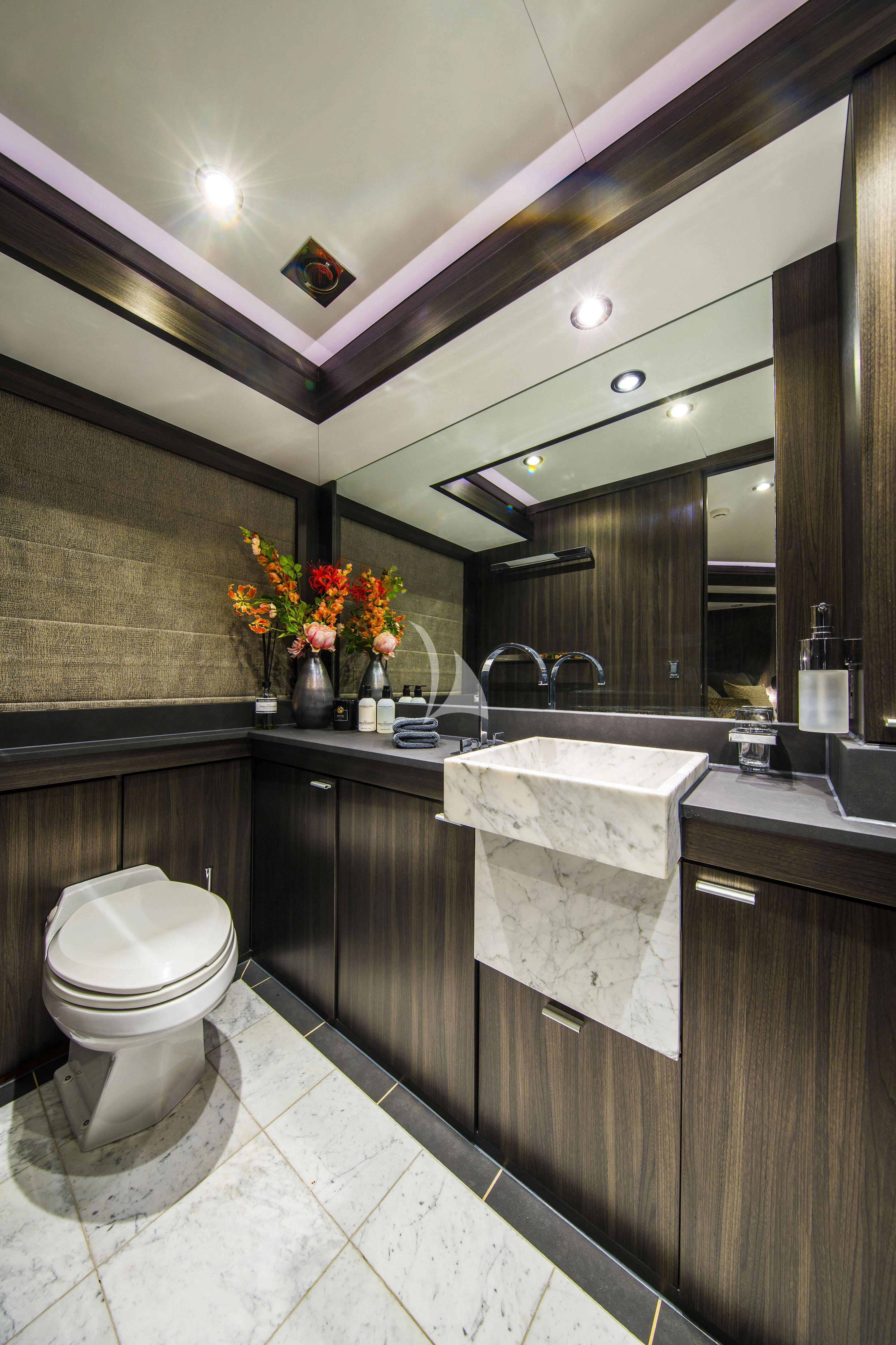 a bathroom with a toilet and sink aboard BAGHEERA Yacht for Charter