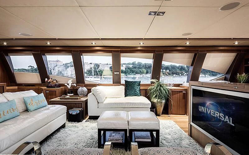 a living room with a large window aboard BAGHEERA Yacht for Charter