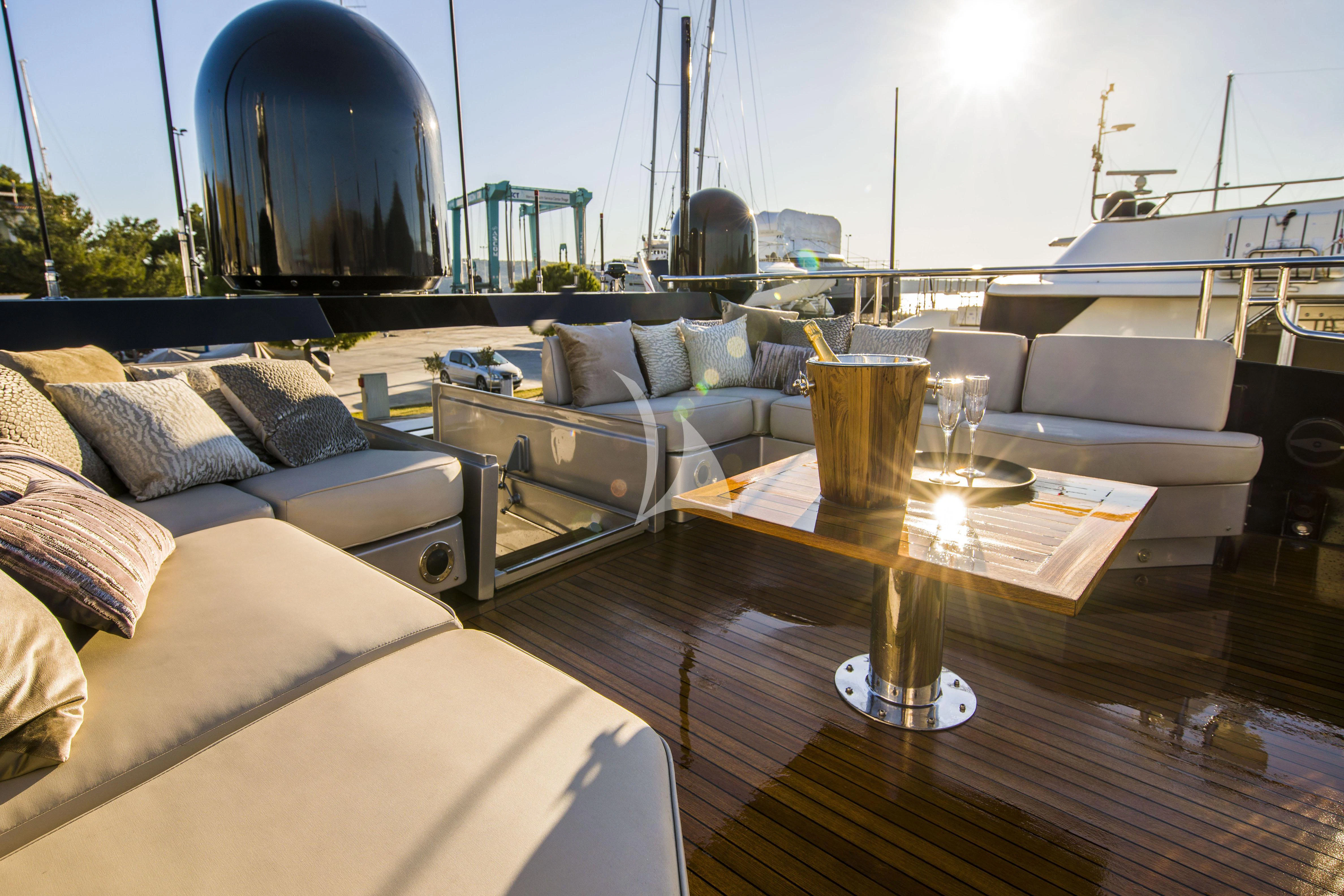 a living room with a large round mirror aboard BAGHEERA Yacht for Charter