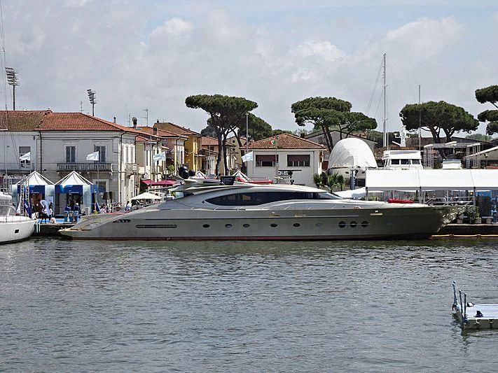 a boat in the water with Balboa Island Ferry in the background aboard BAGHEERA Yacht for Charter