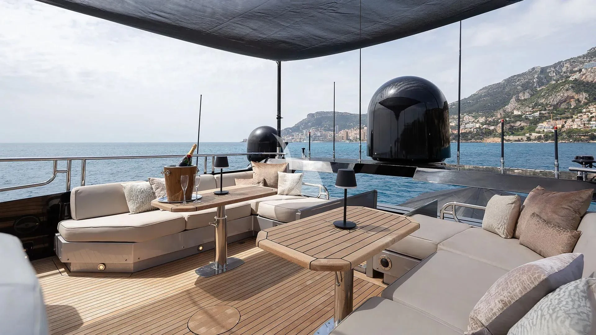 a large living room with a large black fireplace aboard BAGHEERA Yacht for Charter