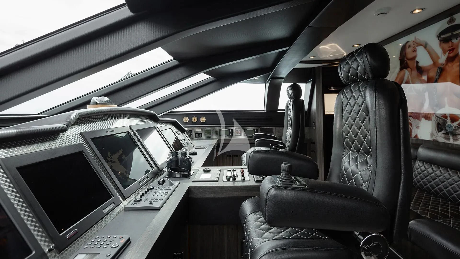 a car with a laptop and a monitor on the dashboard aboard BAGHEERA Yacht for Charter
