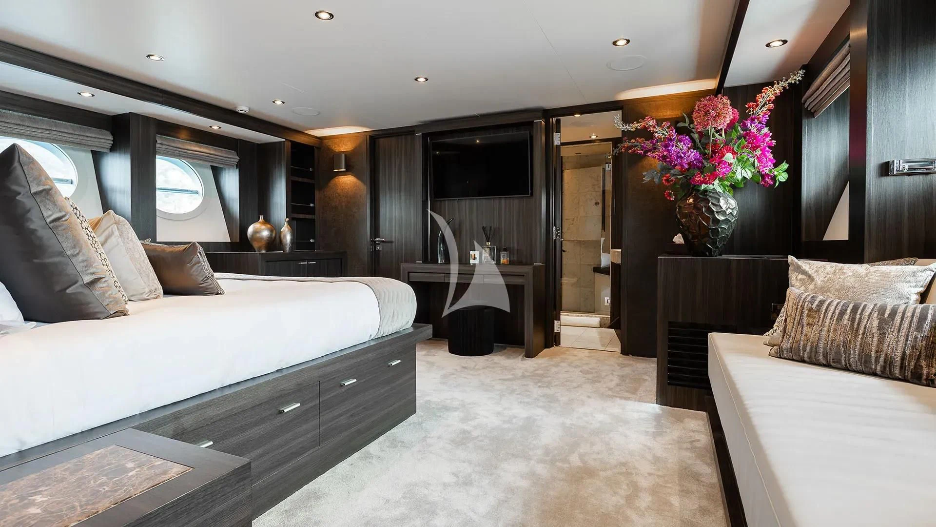 a room with a bed and a desk aboard BAGHEERA Yacht for Charter
