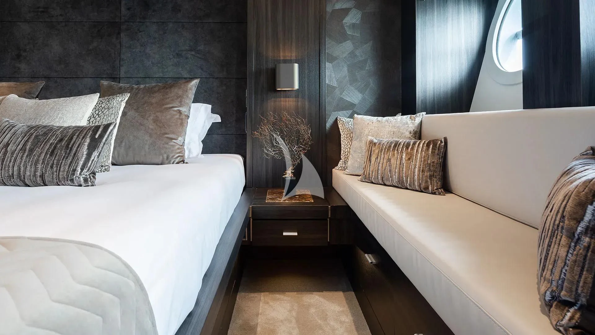 a room with a bed and a mirror aboard BAGHEERA Yacht for Charter