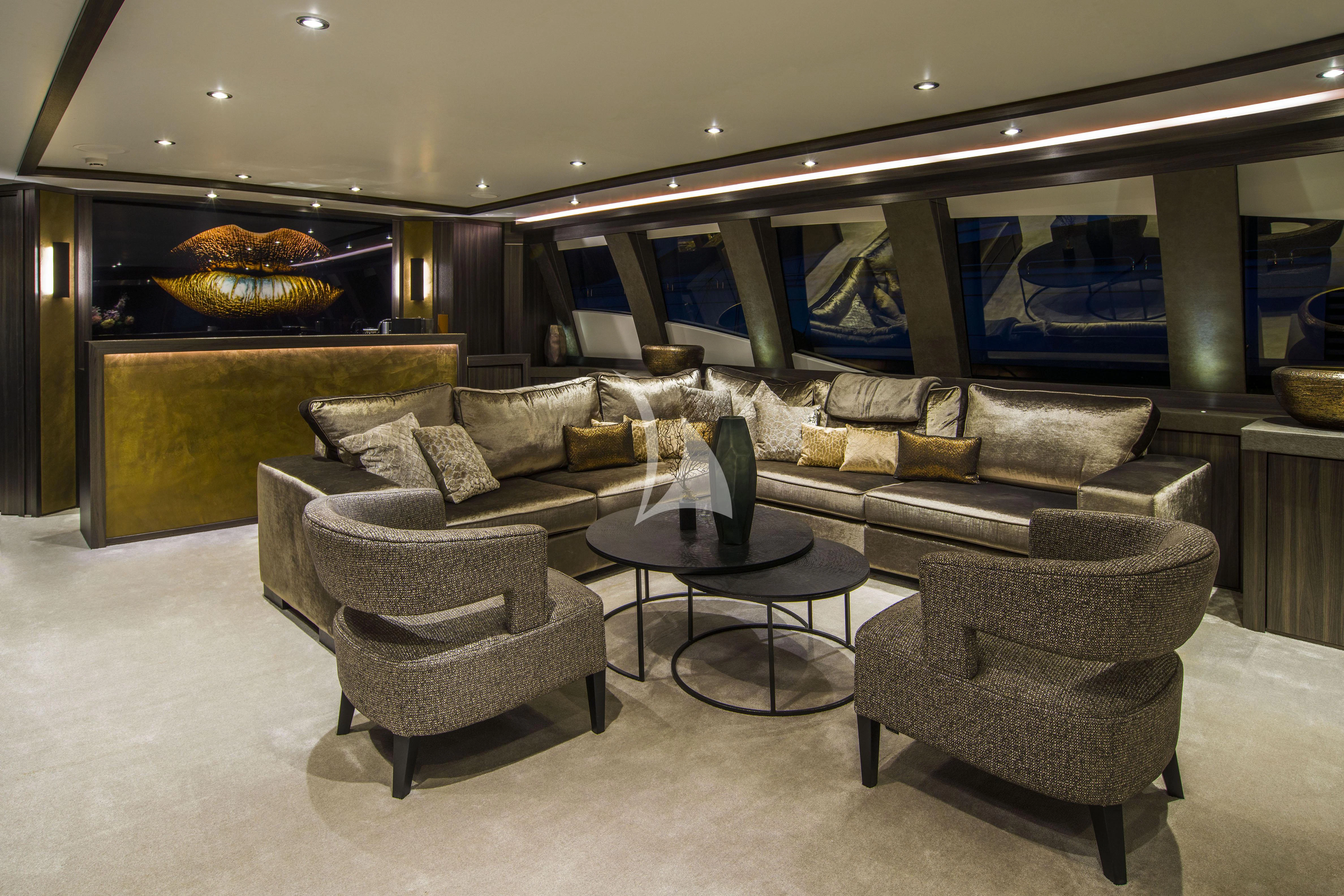 a living room with a large fireplace aboard BAGHEERA Yacht for Charter