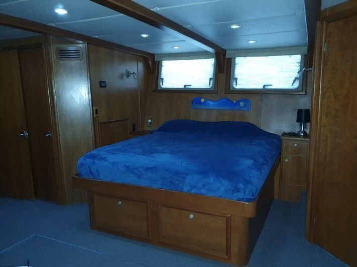 a bed in a room aboard PHANTOM EXPLORER Yacht for Sale