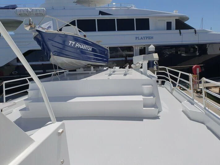 a boat docked at a pier aboard PHANTOM EXPLORER Yacht for Sale