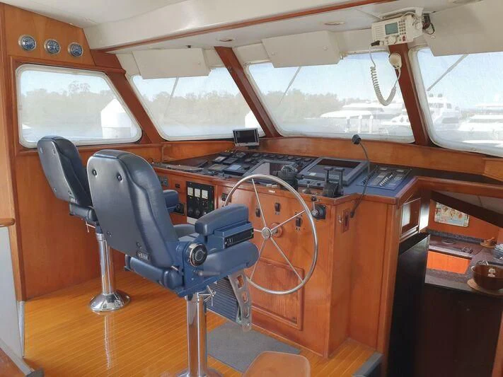 a chair in a room aboard PHANTOM EXPLORER Yacht for Sale
