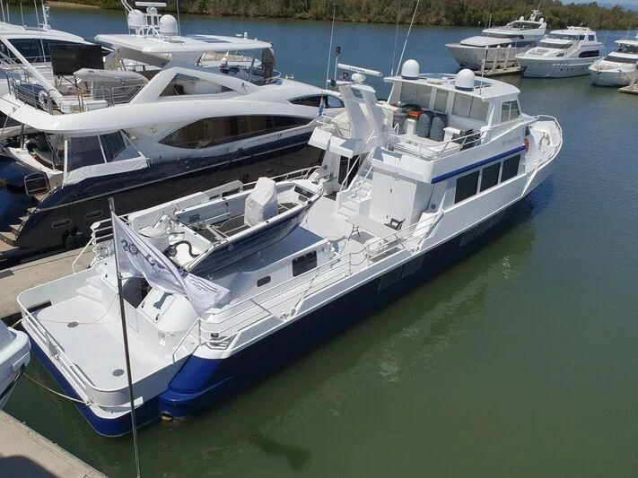 a group of boats in a harbor aboard PHANTOM EXPLORER Yacht for Sale